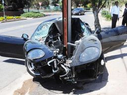A £100,000 Ferrari literally wrapped itself around a telegraph pole after its driver lost control in Adelaide, Australia.  The driver and his passenger walked away from the crash with minor injuries